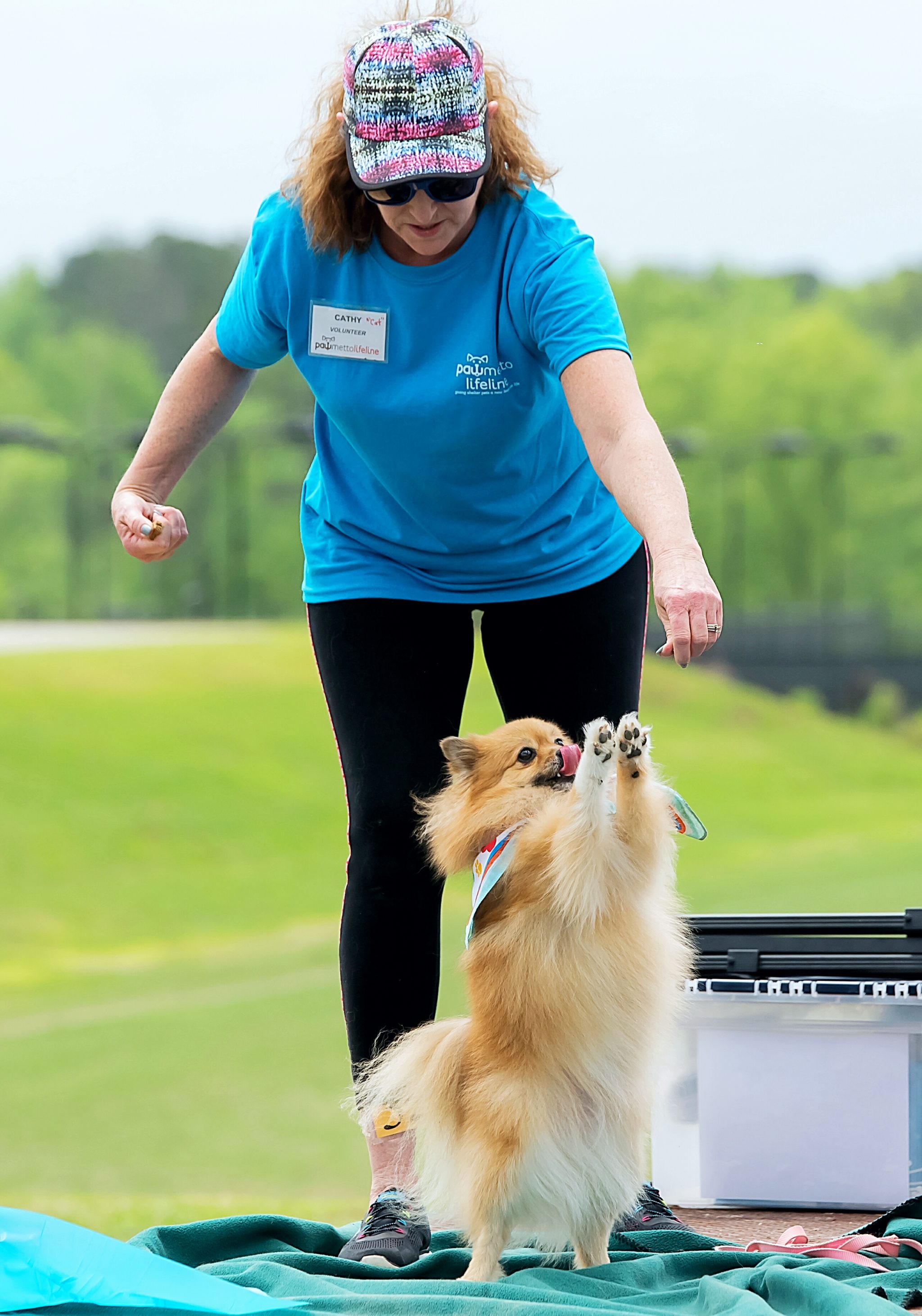 Woman and dog standing pawmetto lifeline